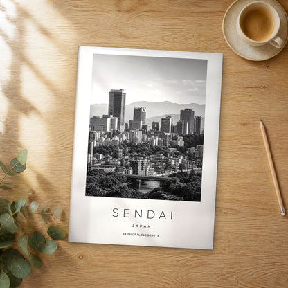Unframed Sendai black and white travel poster on a wooden table