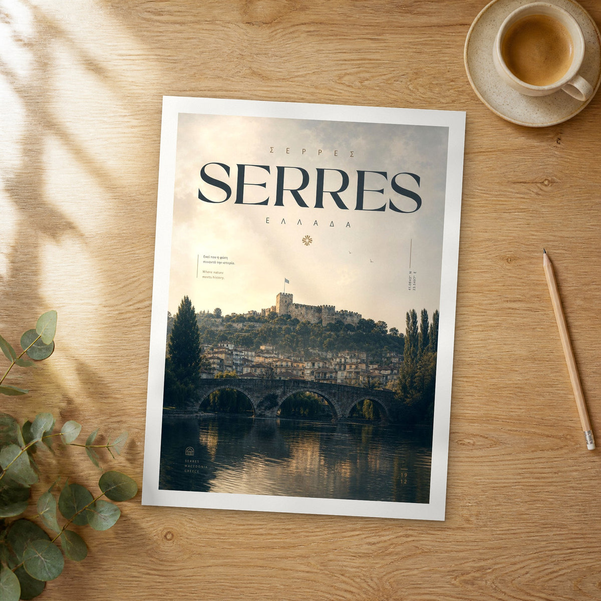 Unframed Serres bold typography travel poster on a wooden table