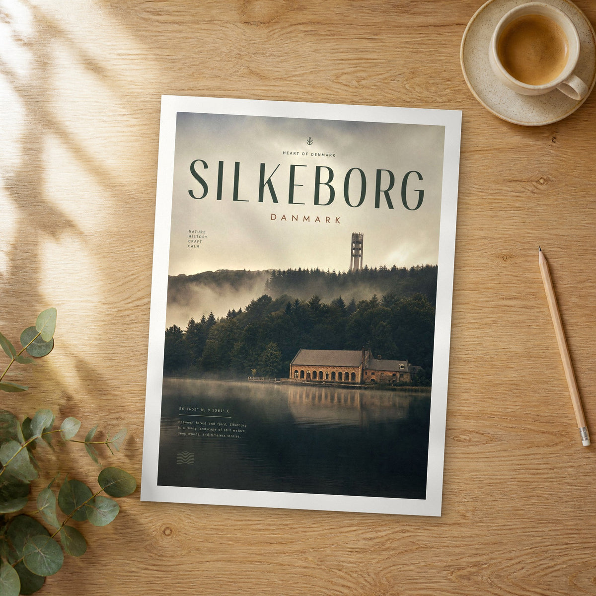 Unframed Silkeborg bold typography travel poster on a wooden table