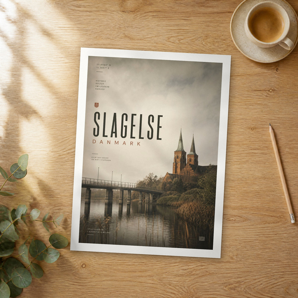 Unframed Slagelse bold typography travel poster on a wooden table
