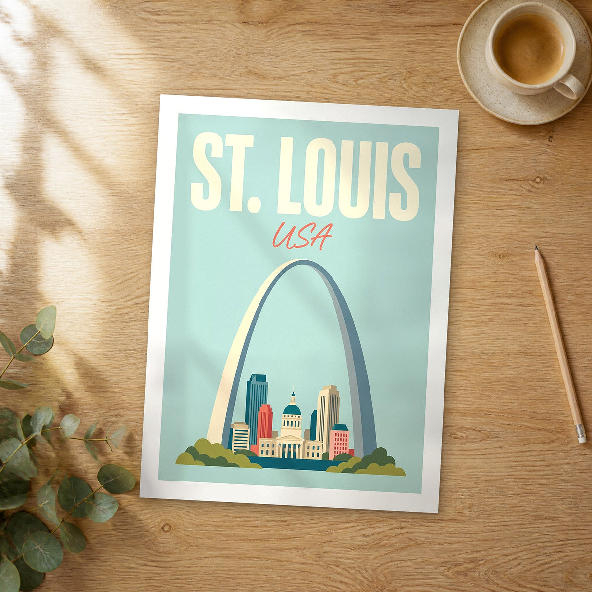 Unframed St. Louis pastel pop art travel poster on a wooden table