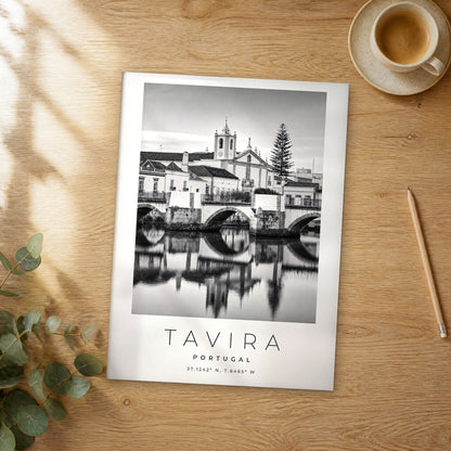 Unframed Tavira black and white travel poster on a wooden table
