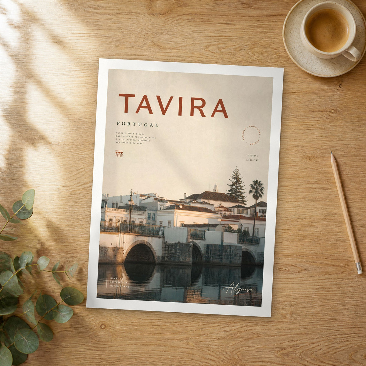 Unframed Tavira bold typography travel poster on a wooden table