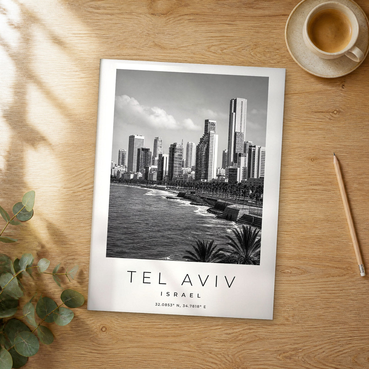 Unframed Tel Aviv black and white travel poster on a wooden table