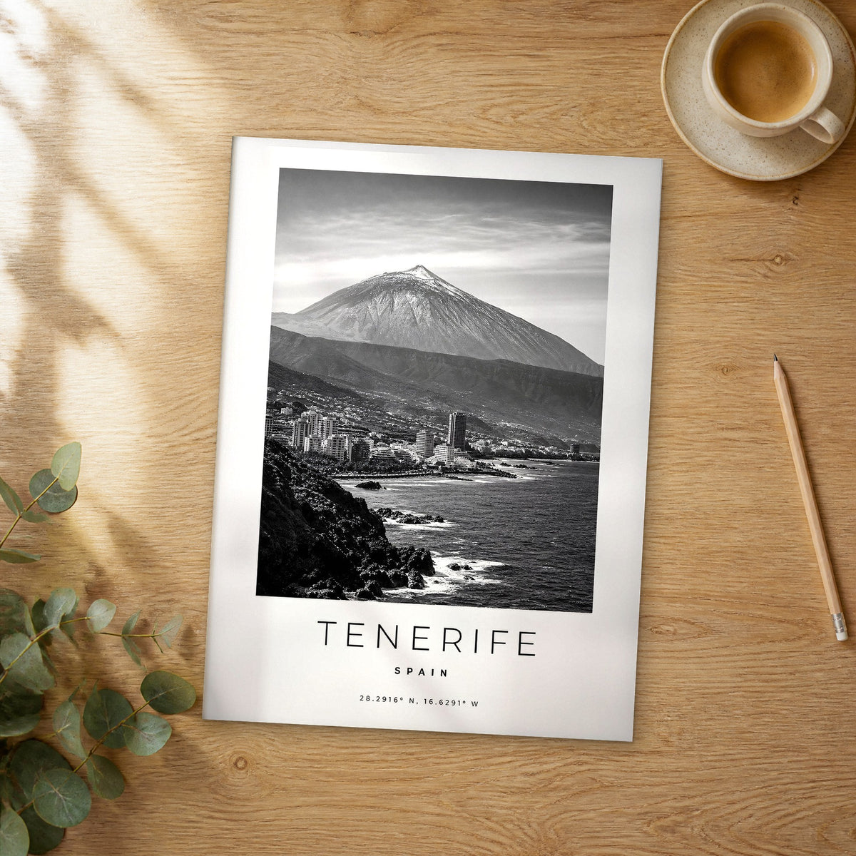 Unframed Tenerife black and white travel poster on a wooden table