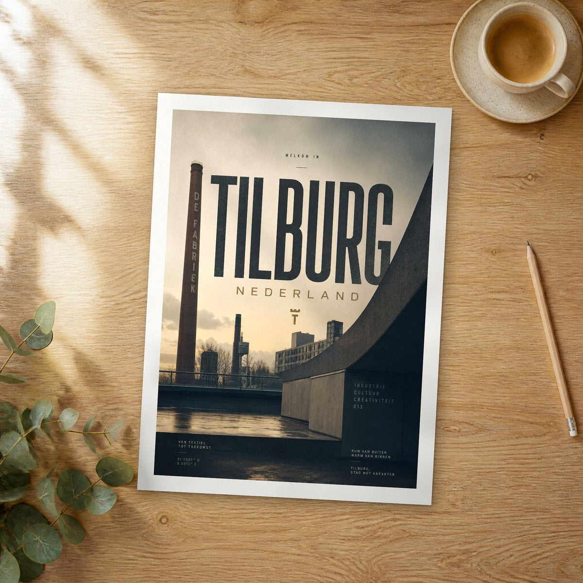 Unframed Tilburg bold typography travel poster on a wooden table