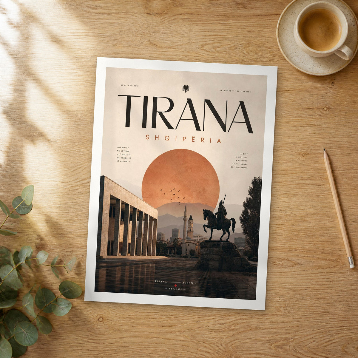 Unframed Tirana bold typography travel poster on a wooden table