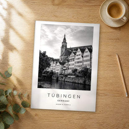 Unframed Tübingen black and white travel poster on a wooden table