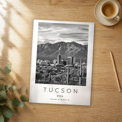 Unframed Tucson black and white travel poster on a wooden table