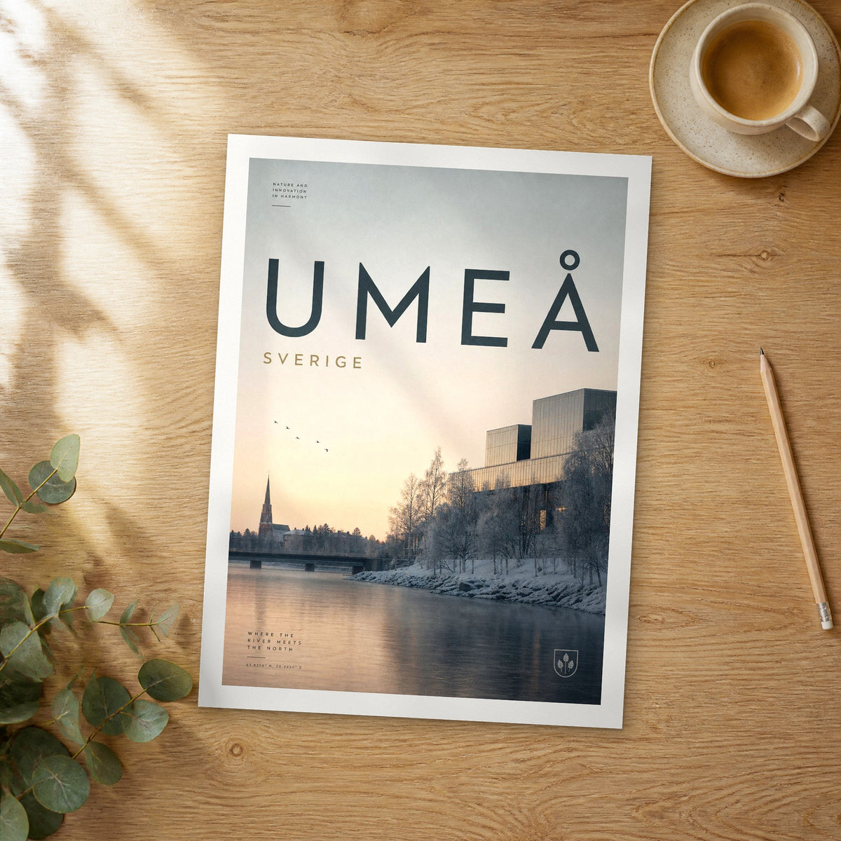 Unframed Umeå bold typography travel poster on a wooden table