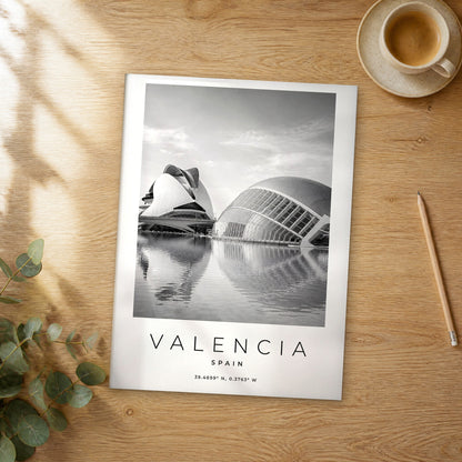 Unframed Valencia black and white travel poster on a wooden table