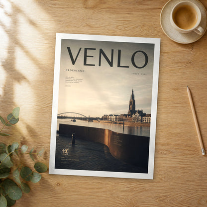 Unframed Venlo bold typography travel poster on a wooden table