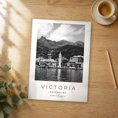 Unframed Victoria black and white travel poster on a wooden table
