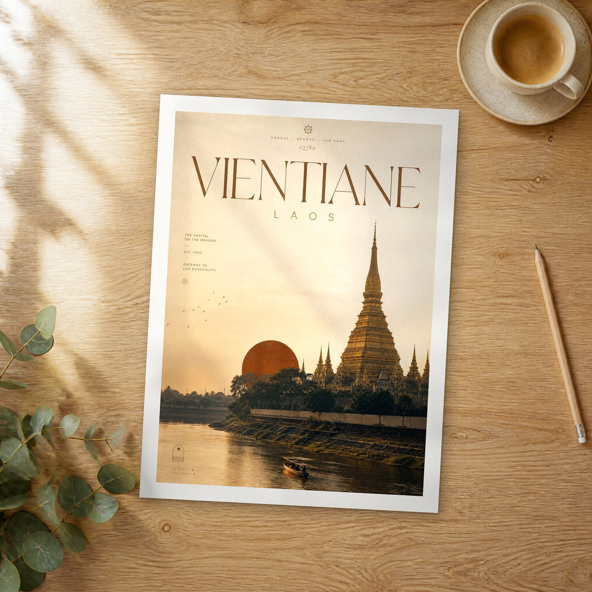 Unframed Vientiane bold typography travel poster on a wooden table
