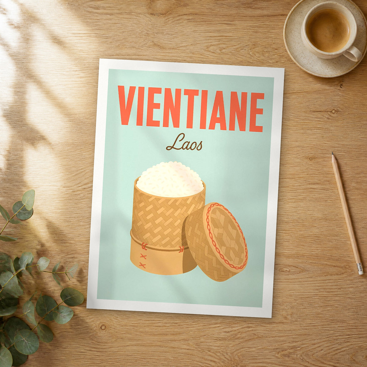 Unframed Vientiane pop art travel poster on a wooden table