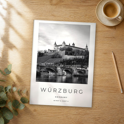 Unframed Würzburg black and white travel poster on a wooden table