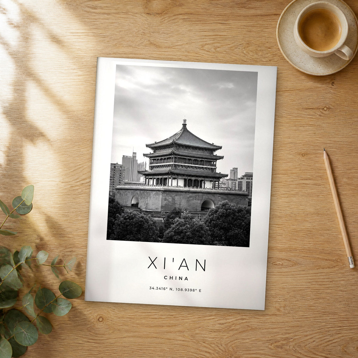 Unframed Xi'an black and white travel poster on a wooden table