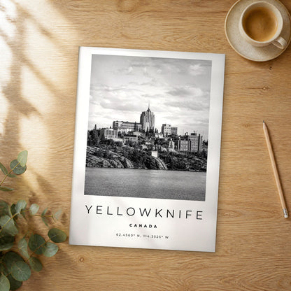 Unframed Yellowknife black and white travel poster on a wooden table